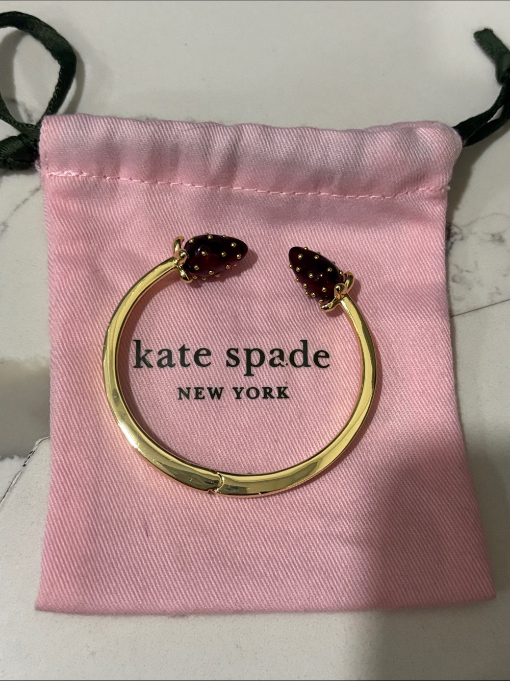kate spade Gold Hinged Bracelet with Burgundy Strawberry Ends